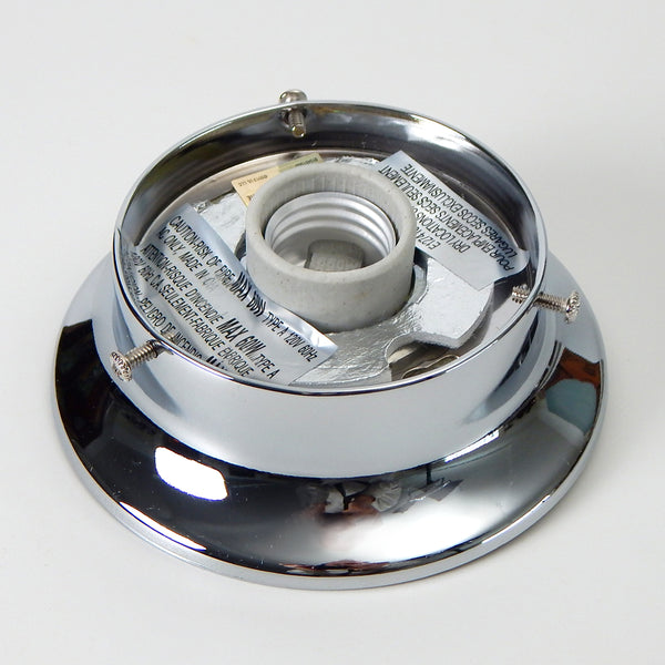 3 1/4 inch flush mount light fixture fitter/shade holder with your choice of polished chrome, satin nickel, or antique brass finishes. Its simple low profile design is a solid choice for Mid-Century era glass shades whether it's a wall-mounted sconce or a ceiling-mounted light. Available at www.vintporium.com