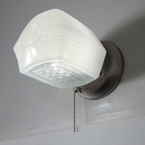 Vintage Art Deco wall light with enameled milk glass shade and satin nickel pull-chain base — available at Vintporium.
