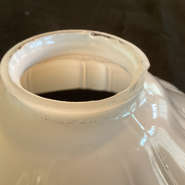 Scalloped edge detail on vintage milk glass lamp shade with ribbed pattern