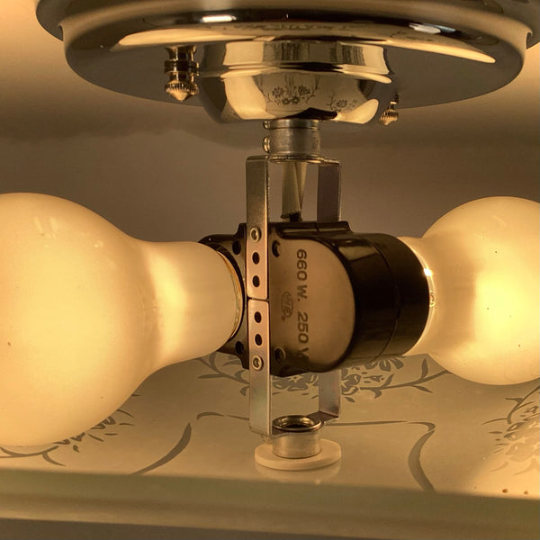 Interior hardware view of mid-century ceiling light showing socket assembly and wiring