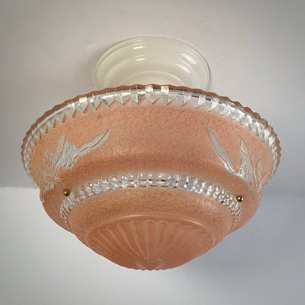 Front view of peach etched glass flush mount ceiling light showing full bowl shape