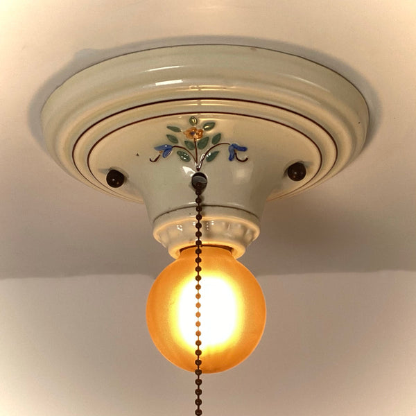 Hand painted porcelain ceiling light with floral decoration and pull chain lit