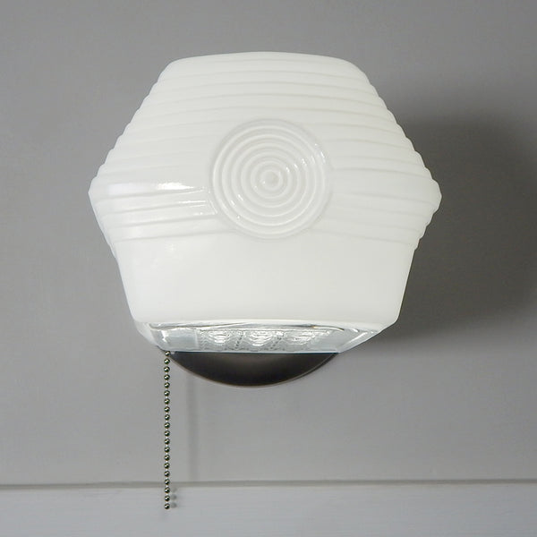 Front view of Art Deco enameled wall sconce with geometric milk glass shade and brushed satin nickel finish.