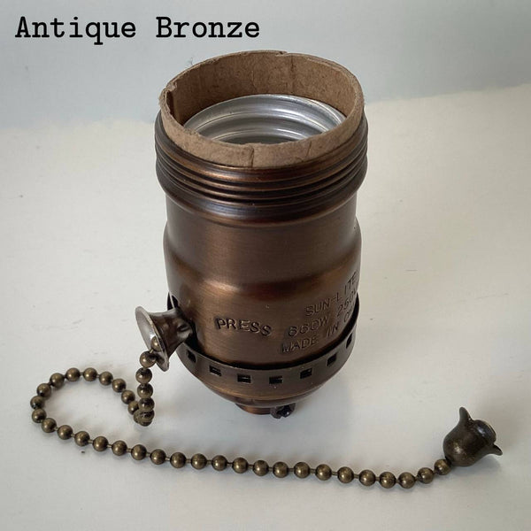 Antique bronze UNO pull-chain socket with warm brown finish and matching pull chain.