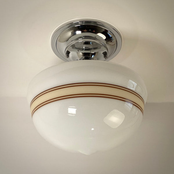 Front view of mocha striped milk glass globe schoolhouse ceiling light fixture