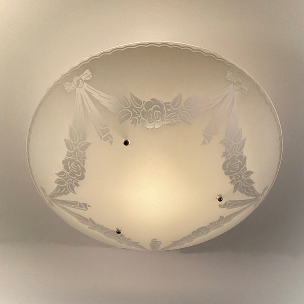 Bottom view of a 1950s semi-flush ceiling light with enameled floral glass design
