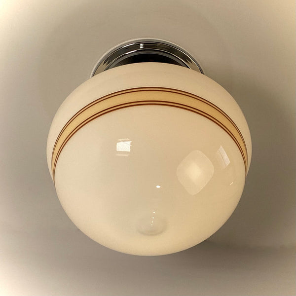 Bottom view of opal milk glass schoolhouse globe with mocha band detail