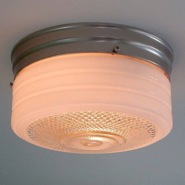 8 Inch Flush Mount Pan Fixture Fitter / Shade Holder / Base Flush mount utility lights reached their popularity in the 1950s and 60s and are still desirable today. It's easy to see why. Its low profile and easy-to-clean design make it an obvious choice for mudrooms, kitchens, pantries, etc. The 8-inch pan comes in your choice of polished chrome, satin nickel, or bronze and includes mounting hardware for easy installation. Available at www.vintporium.com