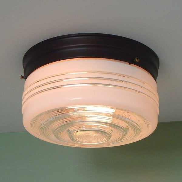 8 Inch Flush Mount Pan Fixture Fitter / Shade Holder / Base Flush mount utility lights reached their popularity in the 1950s and 60s and are still desirable today. It's easy to see why. Its low profile and easy-to-clean design make it an obvious choice for mudrooms, kitchens, pantries, etc. The 8-inch pan comes in your choice of polished chrome, satin nickel, or bronze and includes mounting hardware for easy installation. Available at www.vintporium.com