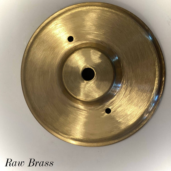 Raw Brass round ceiling canopy with center wire hole and mounting screw holes, used for vintage and modern light fixture restoration at Vintporium.