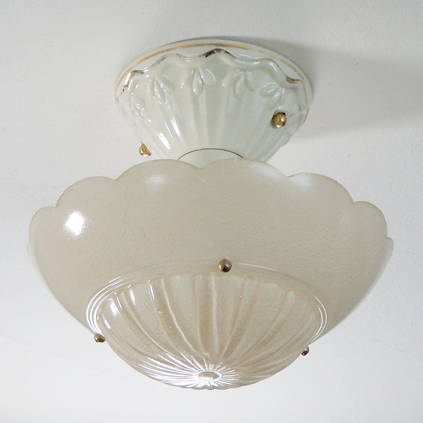 The antique semi-flush porcelain beaded chain drop-down ceiling light fixture has been rewired, cleaned, detailed, and includes installation hardware making it convenient to install. Available at www.vintporium.com