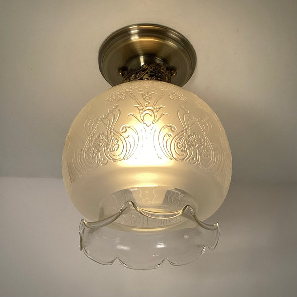 Vintage 1960s Art Nouveau Revival Semi-Flush Ceiling Light Fixture. The restored ceiling light features a new aged brass ceiling canopy with new wiring, a new socket, etc., while preserving its authentic 196s0s appeal. The fixture has been cleaned and detailed, and the hardware is included for a convenient installation. Available at www.vintporium.com