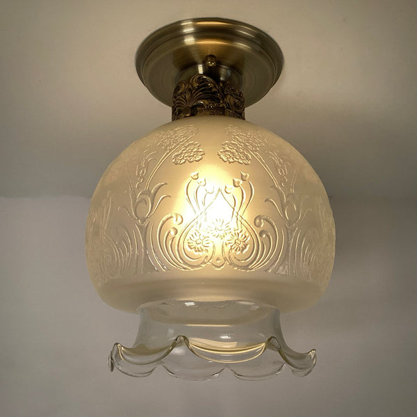 Vintage 1960s Art Nouveau Revival Semi-Flush Ceiling Light Fixture. The restored ceiling light features a new aged brass ceiling canopy with new wiring, a new socket, etc., while preserving its authentic 196s0s appeal. The fixture has been cleaned and detailed, and the hardware is included for a convenient installation. Available at www.vintporium.com