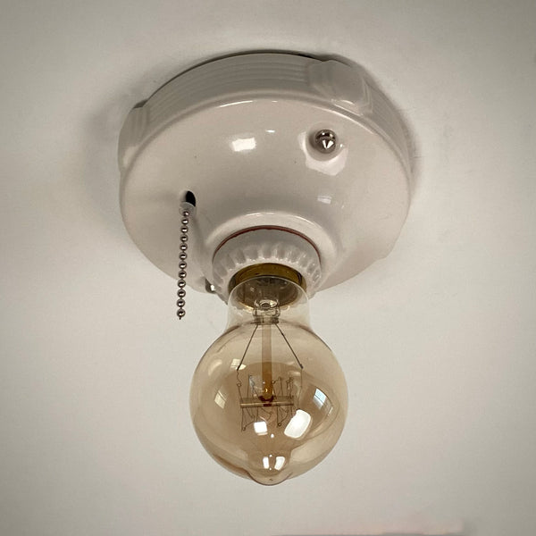 Vintage Deco Flush Mount Ceiling Light Fixture with Pull Chain. This vintage deco porcelain light fixture has been restored and features a new porcelain pull chain socket, wiring, etc. The fixture has been cleaned and detailed, making for a convenient installation.