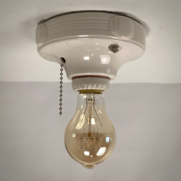 Vintage Deco Flush Mount Ceiling Light Fixture with Pull Chain. This vintage deco porcelain light fixture has been restored and features a new porcelain pull chain socket, wiring, etc. The fixture has been cleaned and detailed, making for a convenient installation.