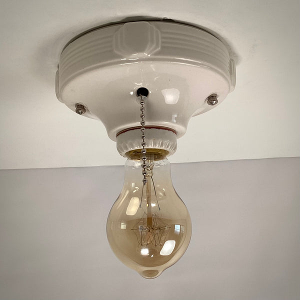 Vintage Deco Flush Mount Ceiling Light Fixture with Pull Chain. This vintage deco porcelain light fixture has been restored and features a new porcelain pull chain socket, wiring, etc. The fixture has been cleaned and detailed, making for a convenient installation.