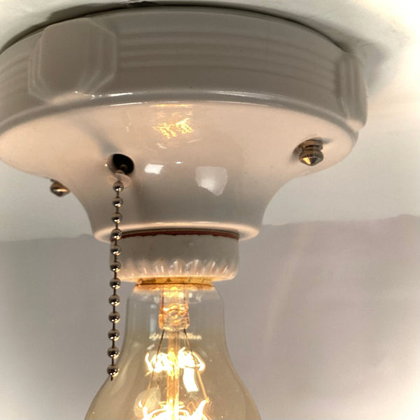 Vintage Deco Flush Mount Ceiling Light Fixture with Pull Chain. This vintage deco porcelain light fixture has been restored and features a new porcelain pull chain socket, wiring, etc. The fixture has been cleaned and detailed, making for a convenient installation.