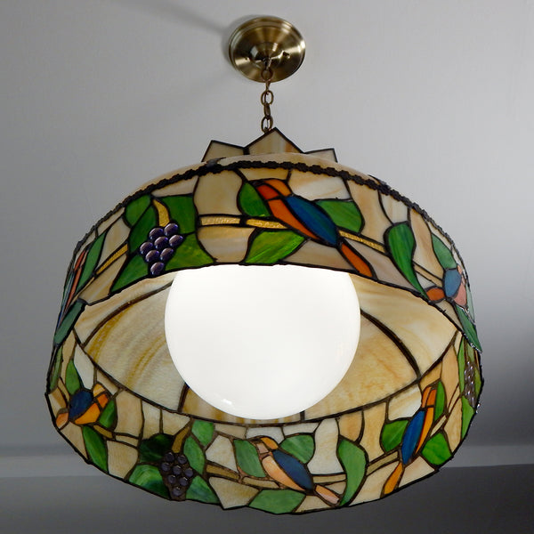 Vintage Slag and Stained Glass Ceiling Pendant Light Fixture. Slag glass was popular in the late nineteenth and early twentieth century. However, fortunately, there was a rebirth of interest in slag glass in the 1970s, and several producers developed lighting influenced by those old slag glass pieces. Available at www.vintporium.com