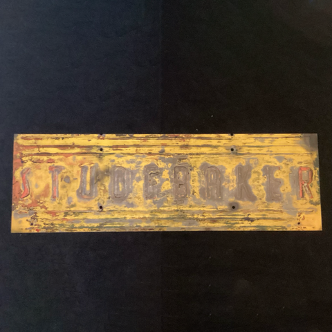 1950s Studebaker truck tailgate section showing embossed lettering and rust