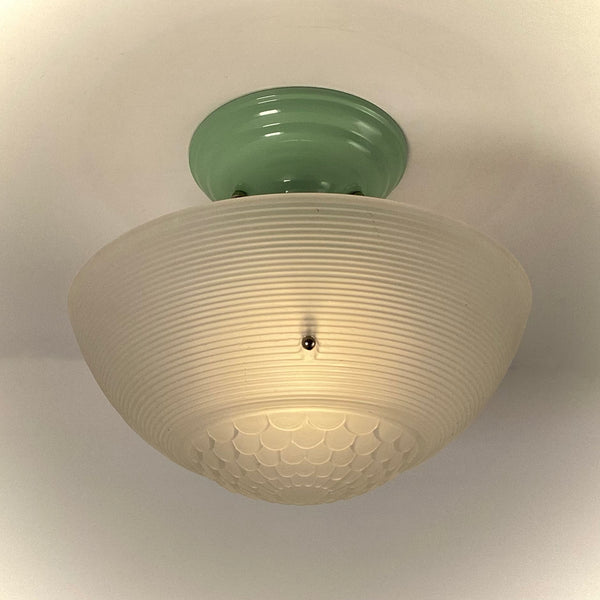 Vintage jadeite-green ceiling light with illuminated ribbed glass shade