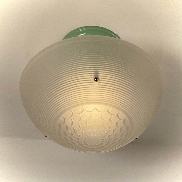 Ribbed frosted glass shade with scalloped bottom pattern on jadeite-green ceiling fixture