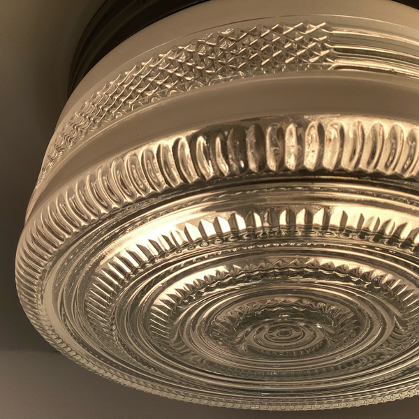 Vintage post-war flush mount ceiling light with clear pressed glass shade and chrome base. 