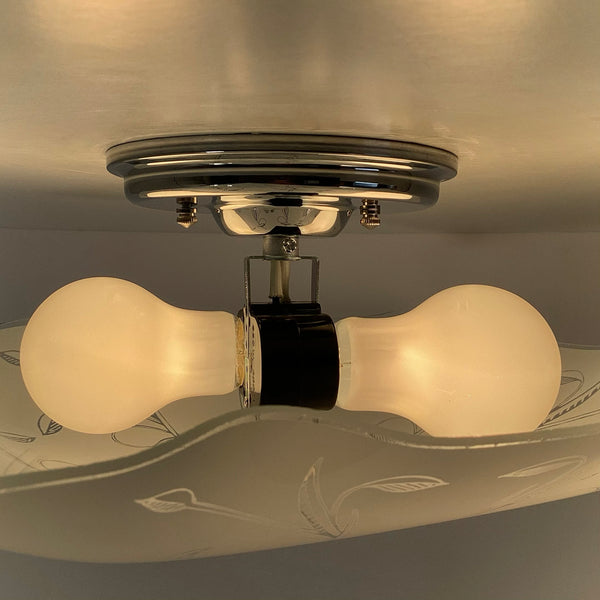 Post-War Era Ceiling Light. Vintage Shade. Custom Fixture. The fixture features a custom-built assembly in a nickel finish. The light has been cleaned and detailed, and the installation includes hardware for convenience. Available at www.vintporium.com