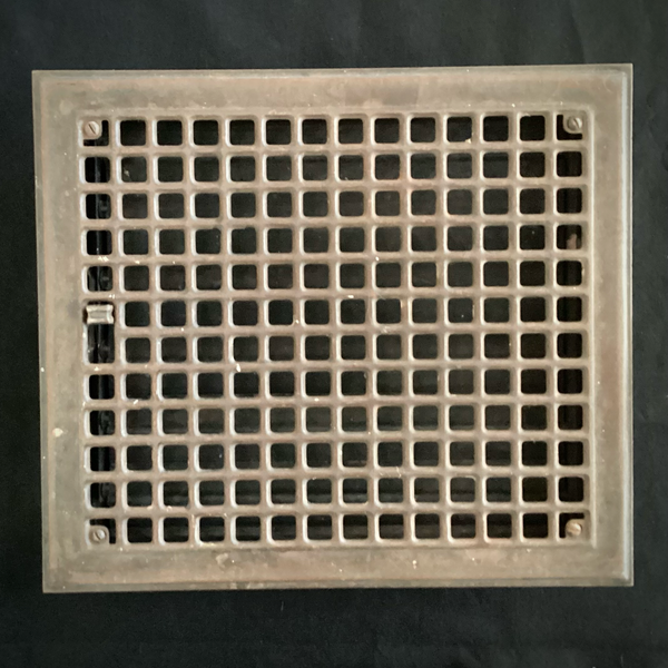 Antique Steel Hear Floor Register. Add a touch of industrial charm and historic character to your space with this antique 1910s heat register, featuring a classic square grid design and working damper lever. Available at www.vintporium.com