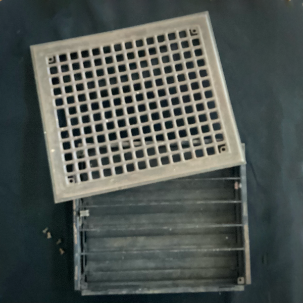 Antique Steel Hear Floor Register. Add a touch of industrial charm and historic character to your space with this antique 1910s heat register, featuring a classic square grid design and working damper lever. Available at www.vintporium.com