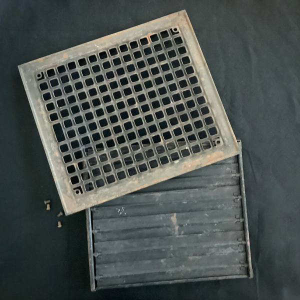 Antique Steel Hear Floor Register. Add a touch of industrial charm and historic character to your space with this antique 1910s heat register, featuring a classic square grid design and working damper lever. Available at www.vintporium.com