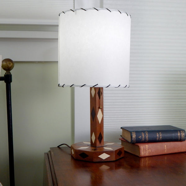 The vintage 1950s table lamp lacks any manufacturer names so its origin story is unknown. Its been clean and oiled, rewired, and is ready to display in your home. Available at www.vintporium.com