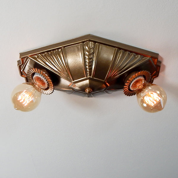 The geometric stamped pattern and buzz saw-inspired bobeches of this flush mount ceiling light is a unique surviving relic of Machine Age décor that would have been produced and marketed to American consumers in the Mid-20th Century. The light fixture has been restored, rewired, and is ready to install for your convenience. Available at www.vintporium.com