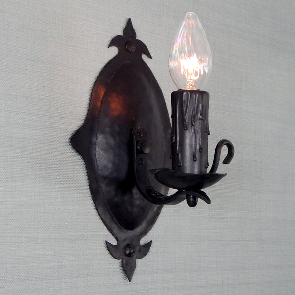 This 1930's antique sconce light fixture will fit well in any of the following Revival-style homes whether they be Spanish, Tudor, Storybook, or Craftsman. The fixture has been restored, detailed, and includes the hardware for easy installation. Available at www.vintporium.com