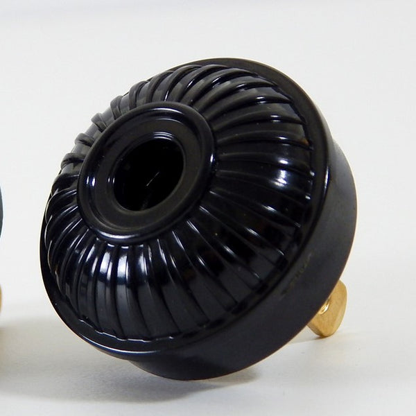 Early electric replica embossed ribbed motif bakelite plug. The plug features an insulator and polarized prongs.  Available at www.vintporium.com